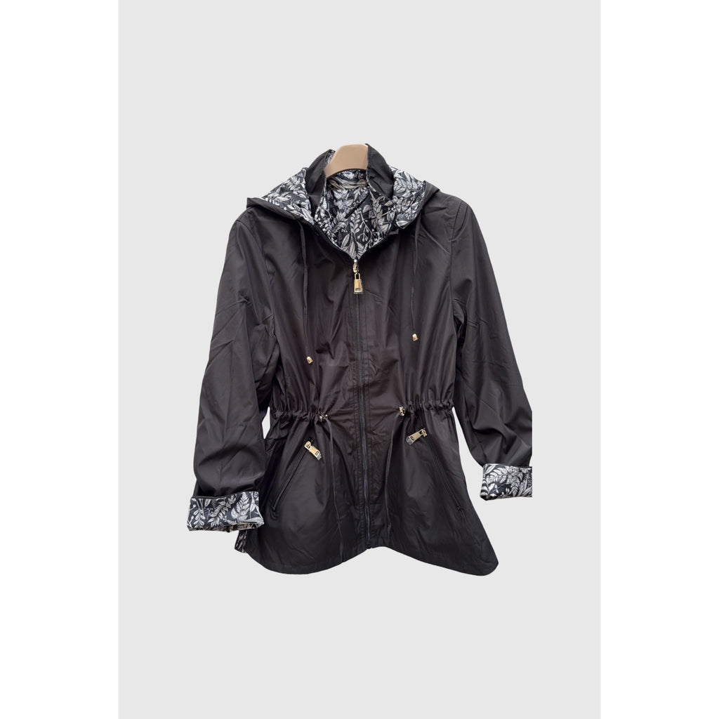 Parka reversible por su cara negra lisa, con bolsillos de cremallera y detalles botánicos en capucha y puños - POLITA 14448001.